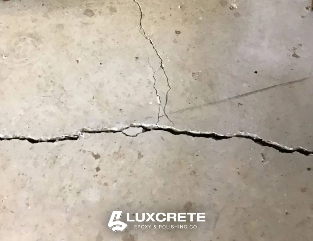 Freeze-thaw crack damage on unsealed concrete garage floor in Wichita, Kansas - Luxcrete Epoxy & Polishing Co - Wichita KS - 003