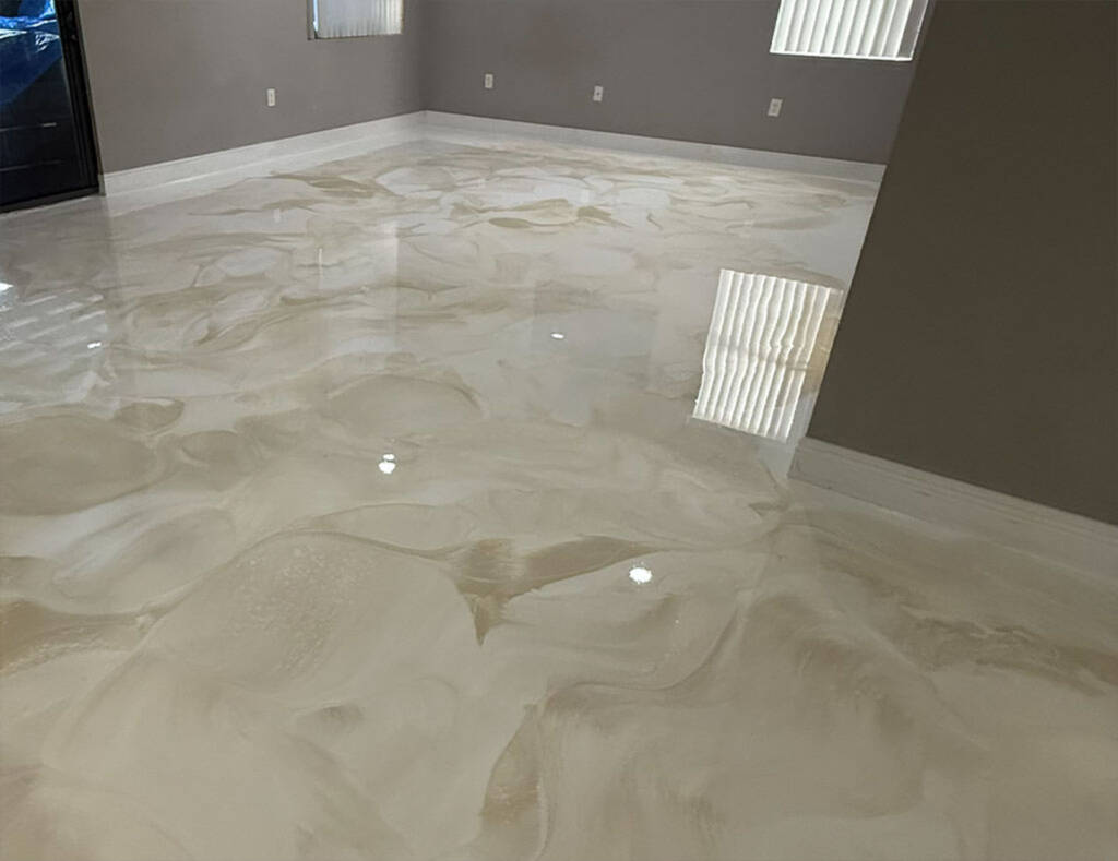 A gorgeous tan and white faux-marble metallic epoxy floor by LuxCrete Epoxy of Wichita, KS